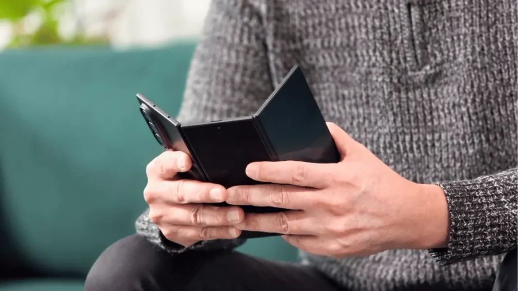 Samsung Galaxy Z TriFold fully unfolded showing 10-inch Dynamic AMOLED display with three apps running side by side