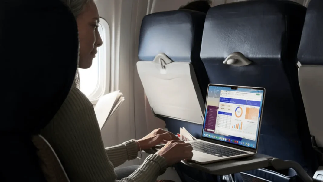 Apple MacBook Air M5 in sky blue showing macOS Tahoe interface with M5 chip performance and AI capabilities in 2026